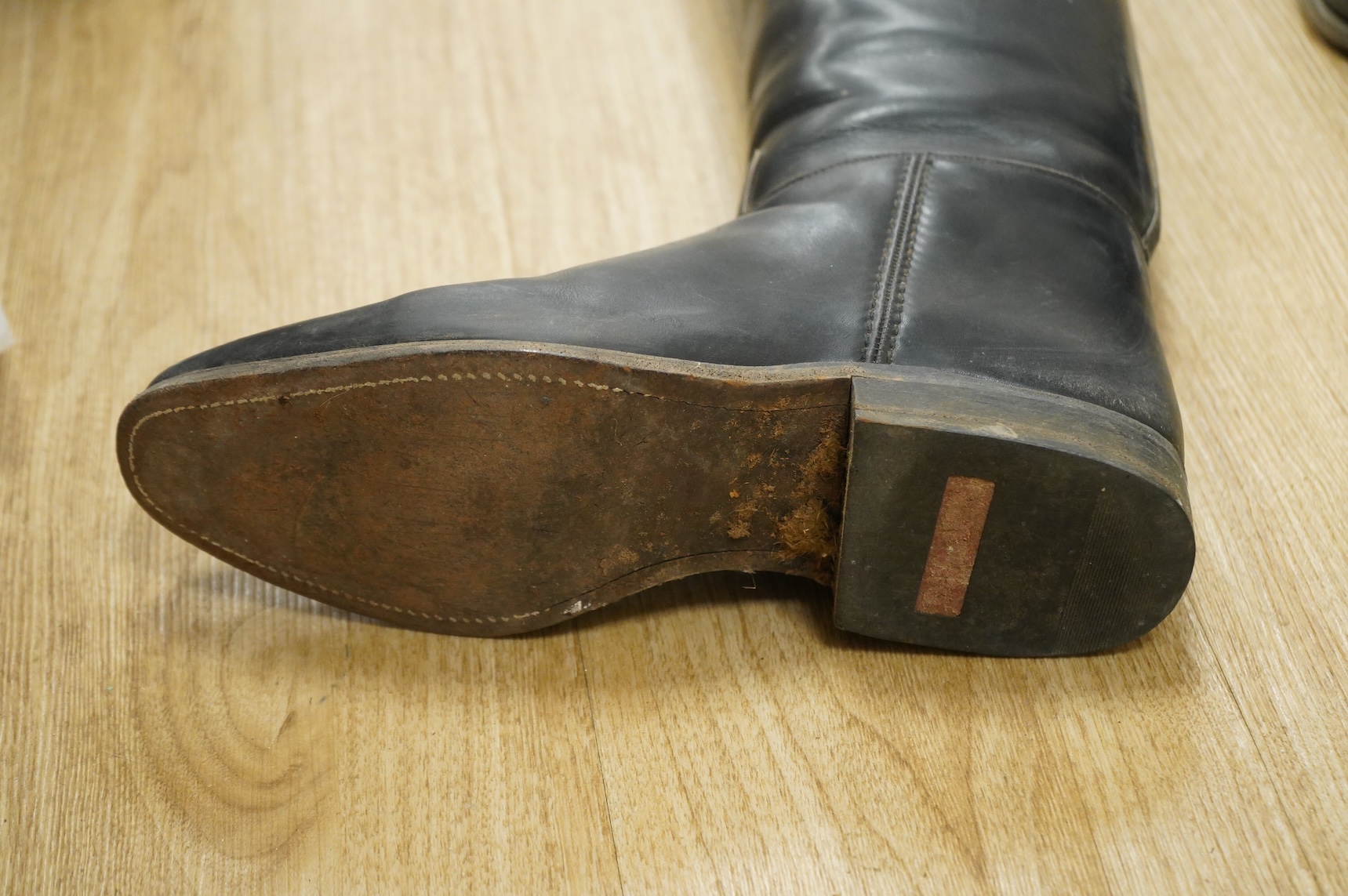 A pair of 20th century black leather riding boots